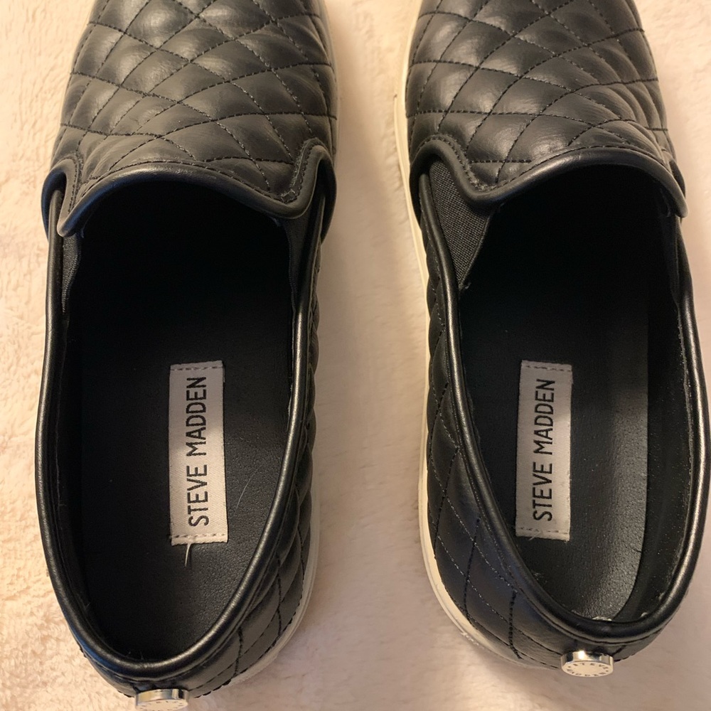 Size 8 M quilted black slip ons with white soles. Excellent condition. $26